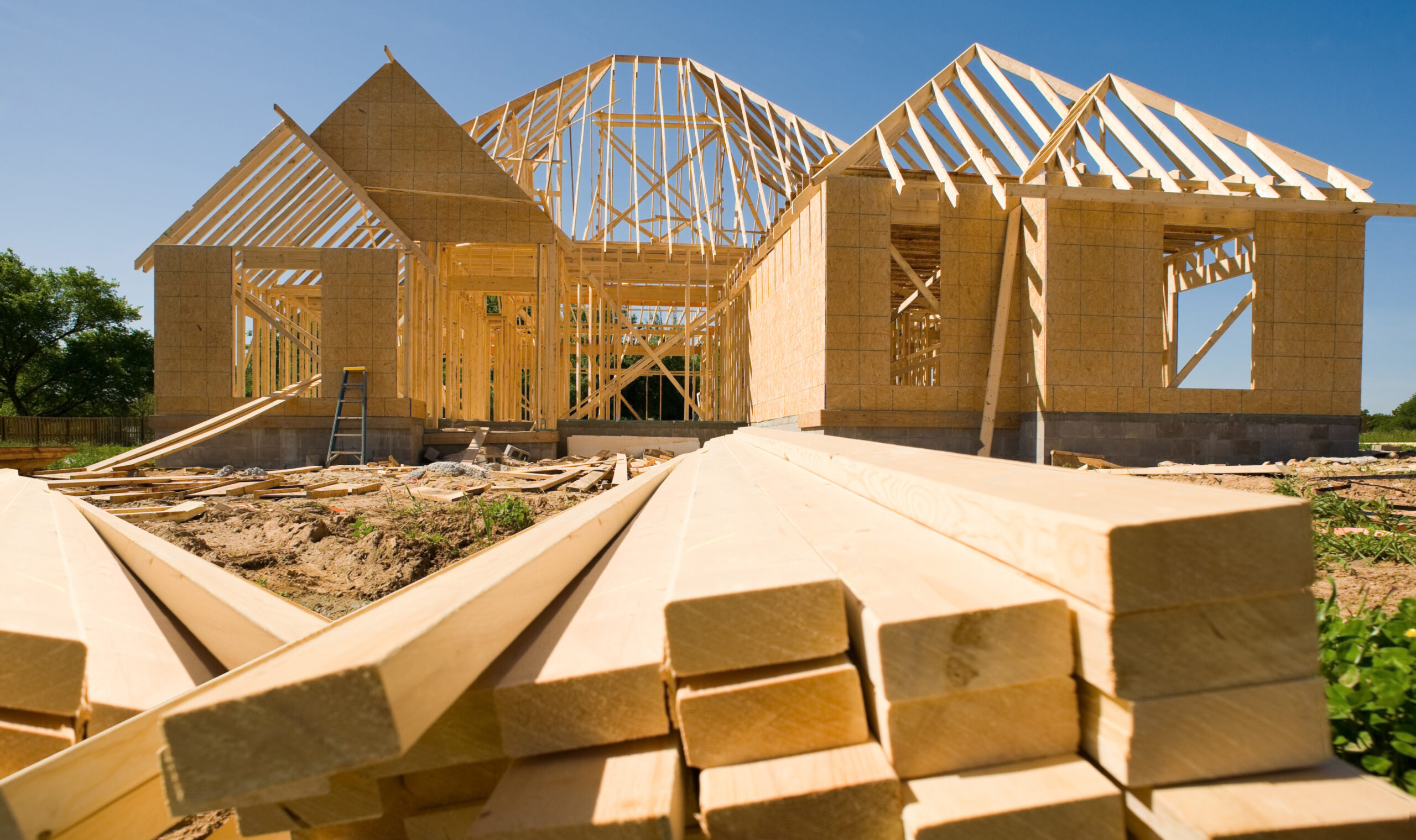 Couple with builder at homesite